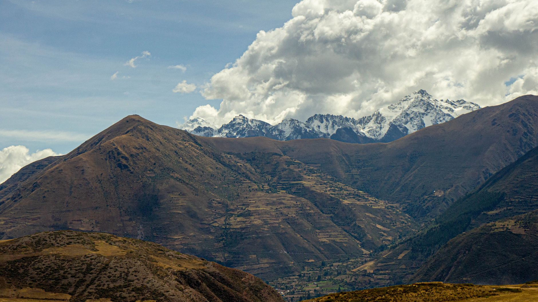 Stunning view of the Andes Mountains and lush valleys in Urubamba, Cusco, Peru.