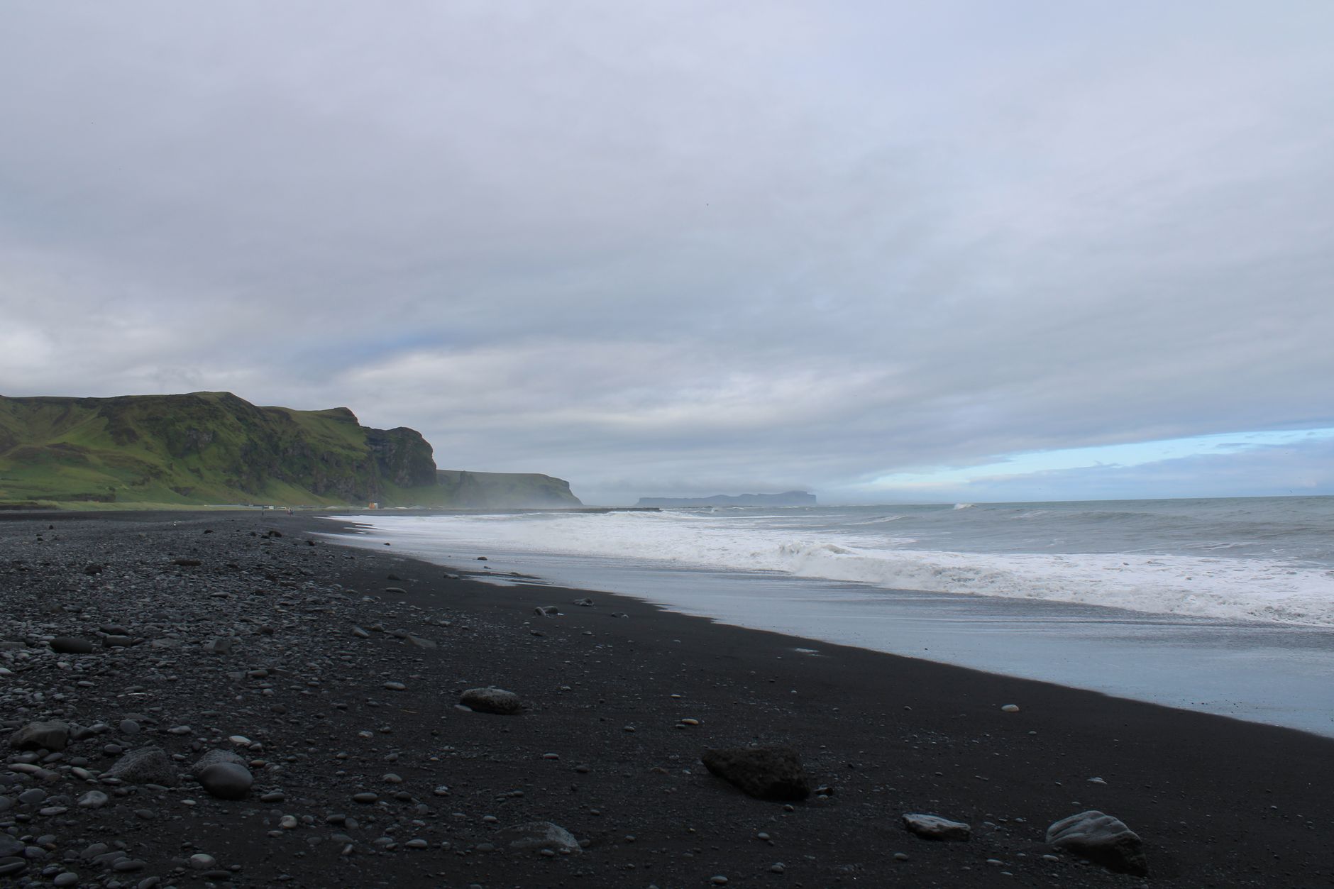 Discover the unique beauty of Iceland's black sand beaches with dramatic coastal views and moody ski